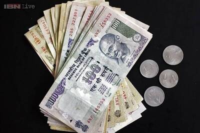 Rupee gains 37 paise, opens at 62.12 against dollar