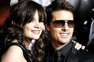 Furious Katie defends 'caring' Cruise