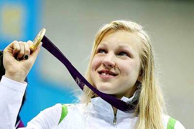 Meilutyte wins women's 100m breaststroke gold