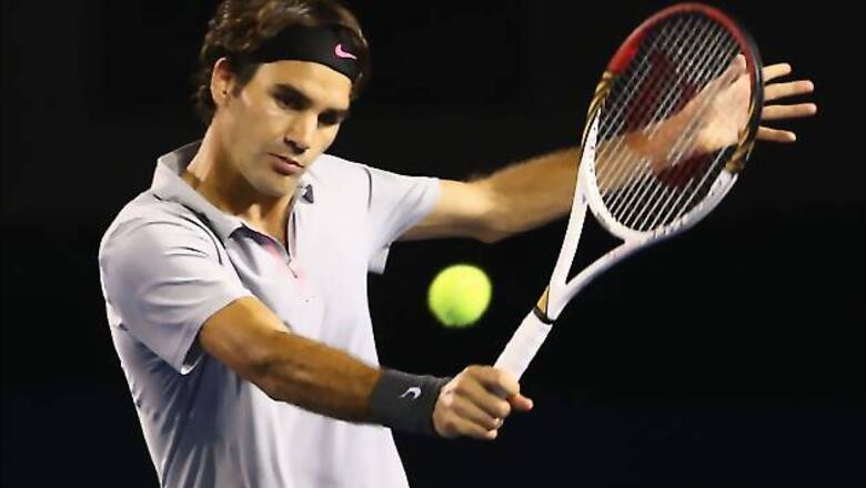 Federer brushes aside Raonic to enter quarter-finals