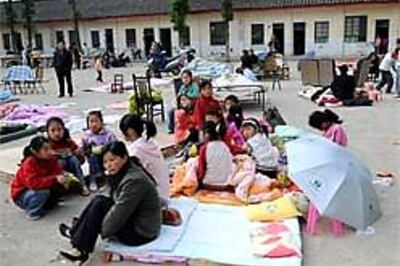 Rain, mudslides hamper relief work in China