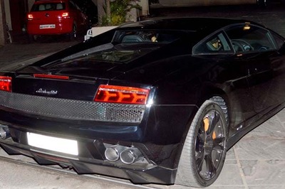 Snapshot: John Abraham buys a black Lamborghini, takes the first ride with Karan Johar