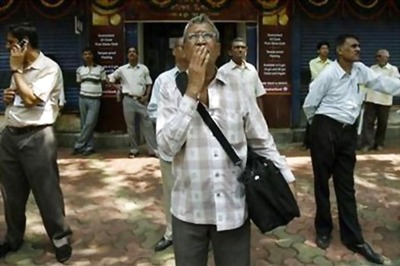 Sensex closes 129 points lower
