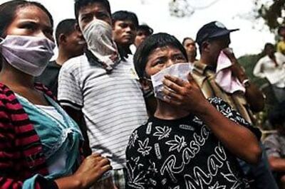 Indonesia prepares for mass burial of quake dead