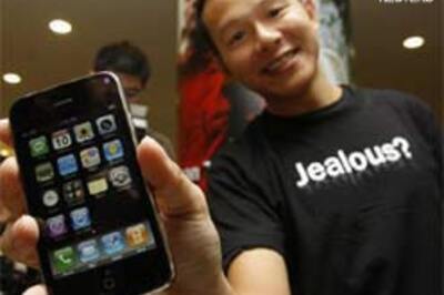 Fans drool over iPhone, but ask for more