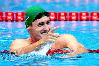 Burgh wins Olympic gold in 100-m breaststroke