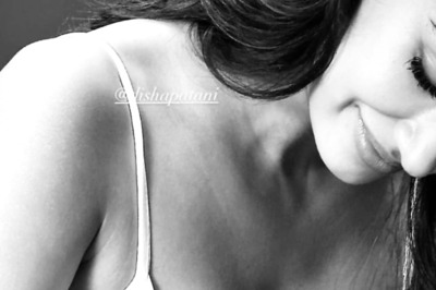 Sexy! Disha Patani Flaunts Her Cleavage In A White Tank Top As She Poses With A Puppy