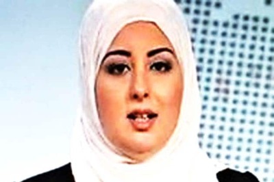 A first: Veiled woman reads news on Egypt state TV