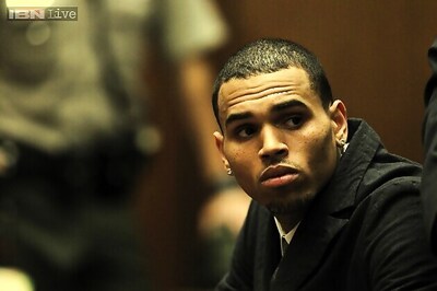 Rapper Chris Brown's bodyguard confesses to punching a man who tried to board Brown's tour bus