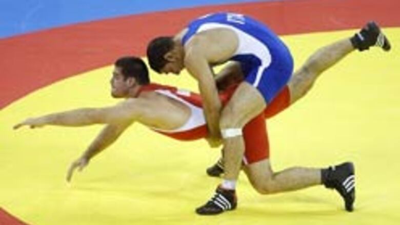 Italian cop, Cuban hold Russia to three Greco-Roman titles