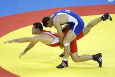 Italian cop, Cuban hold Russia to three Greco-Roman titles