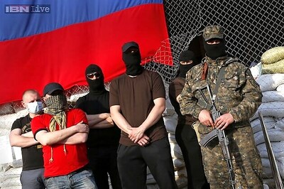 Observers held in Ukraine speak under armed guard
