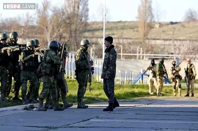 Russian troops seize Crimea airbase as Moscow consolidates control