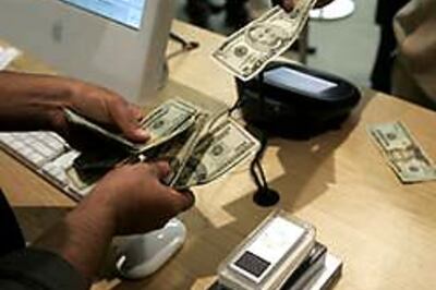 Shoppers spend less when they pay by cash