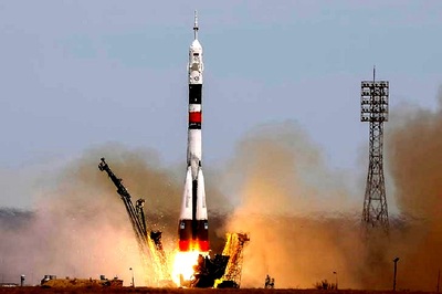 U.S.-Russian Crew Takes Off For Space Station