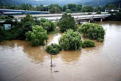 North Korea's Kim inspects flood relief; worry grows about crops