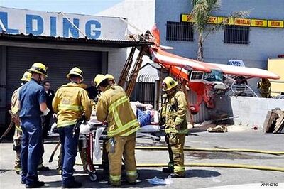 US: Plane crash lands, strikes 2 cars, injures 2