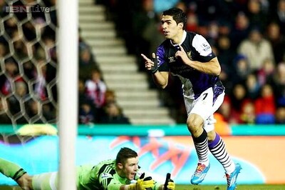 Luis Suarez scores twice as Liverpool beat Stoke 5-3