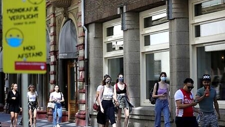 With no nationwide rule, Amsterdam insists on virus masks