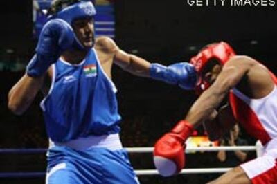 Vijender jabs up while Dinesh bows out in boxing