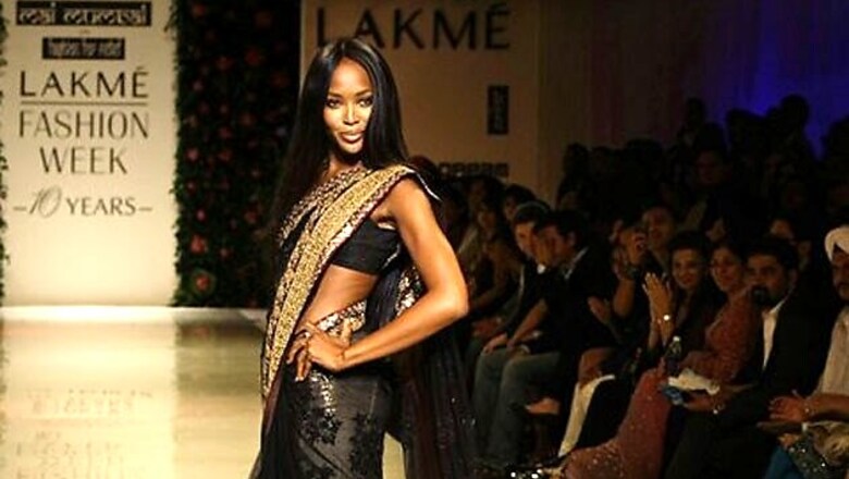 Snapshot: Supermodel Naomi Campbell turns heads in a black sari as she attends a launch event