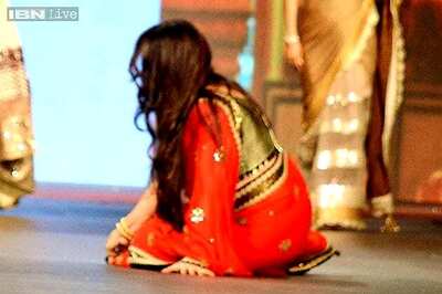 Snapshot: Poonam Dhillon trips over her sari while walking the ramp for Vikram Phadnis