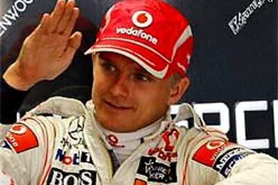 McLaren's Kovalainen takes pole at Silverstone