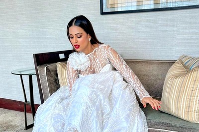 Nia Sharma Turns Heads With Her White Lehenga And Red Bold Heels At Her Brother's Wedding