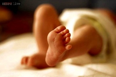 Baby registered in Brazil with two mothers and a father