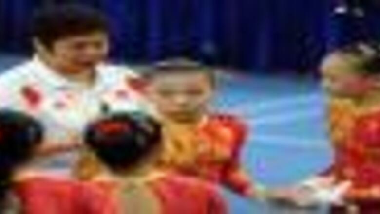 Chinese women edge US in nervy gym qualifiers