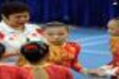 Chinese women edge US in nervy gym qualifiers