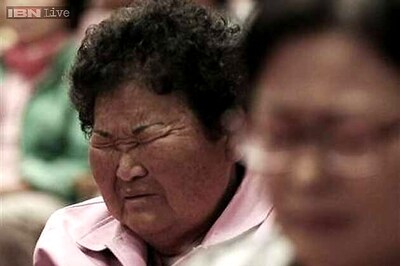 Divers pull bodies from sunken South Korean ferry, toll rises to 50