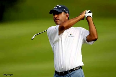Strong start by Jeev in Abu Dhabi; McIlroy, Woods falter