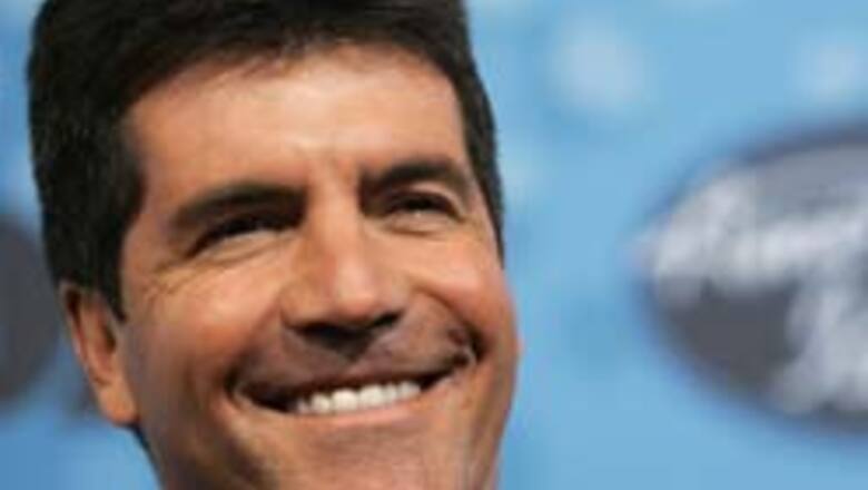 Simon Cowell owns up to spying on his neighbours