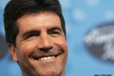 Simon Cowell owns up to spying on his neighbours