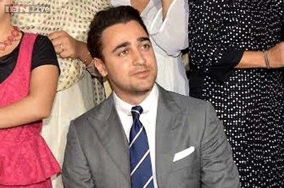 Imran Khan adds a quirky twist to his formal gray suit; wears two different printed socks with black shoes