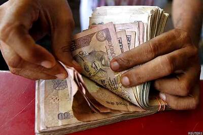 Rupee gains slightly, at 59.34 vs dollar