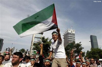 Turks mourn dead as Israel offers probe