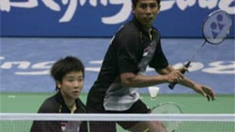 Indonesia's world champs into badminton semis