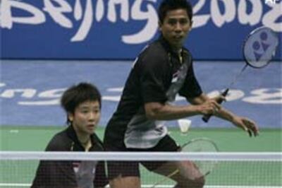 Indonesia's world champs into badminton semis