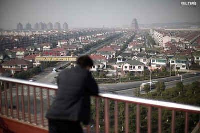 China's rags-to-richest village aims still higher