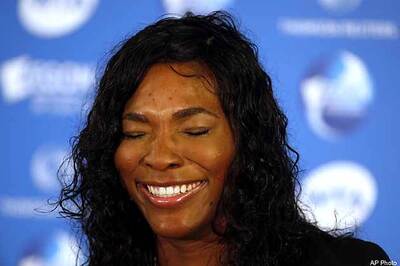 Serena gets in trouble for trying to photograph Tiger Woods